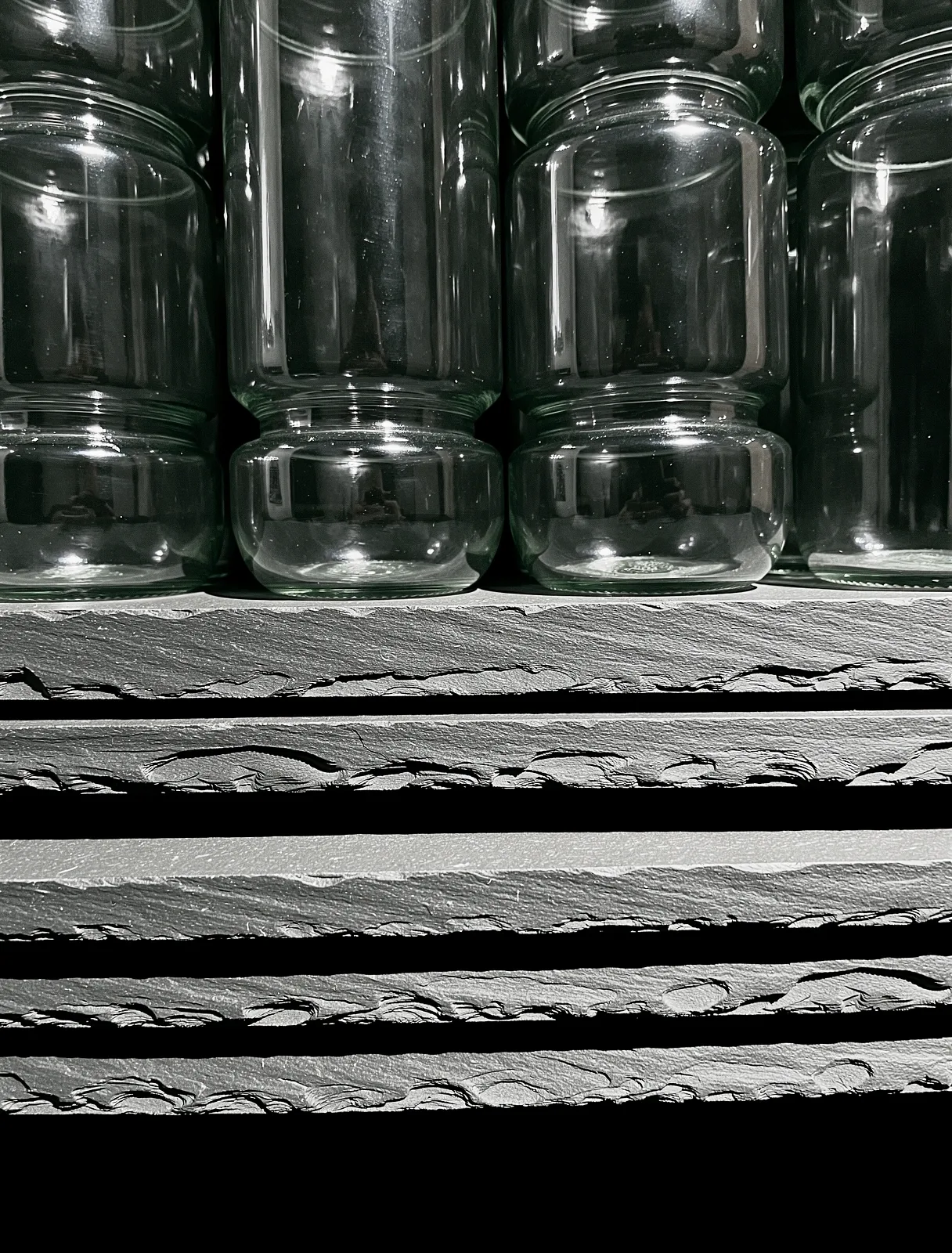 Apothecary glass and stone arrangement